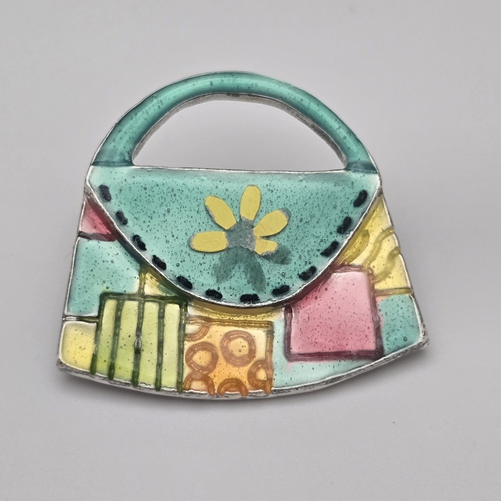 Vibrant Handbag Brooch with Floral Accent